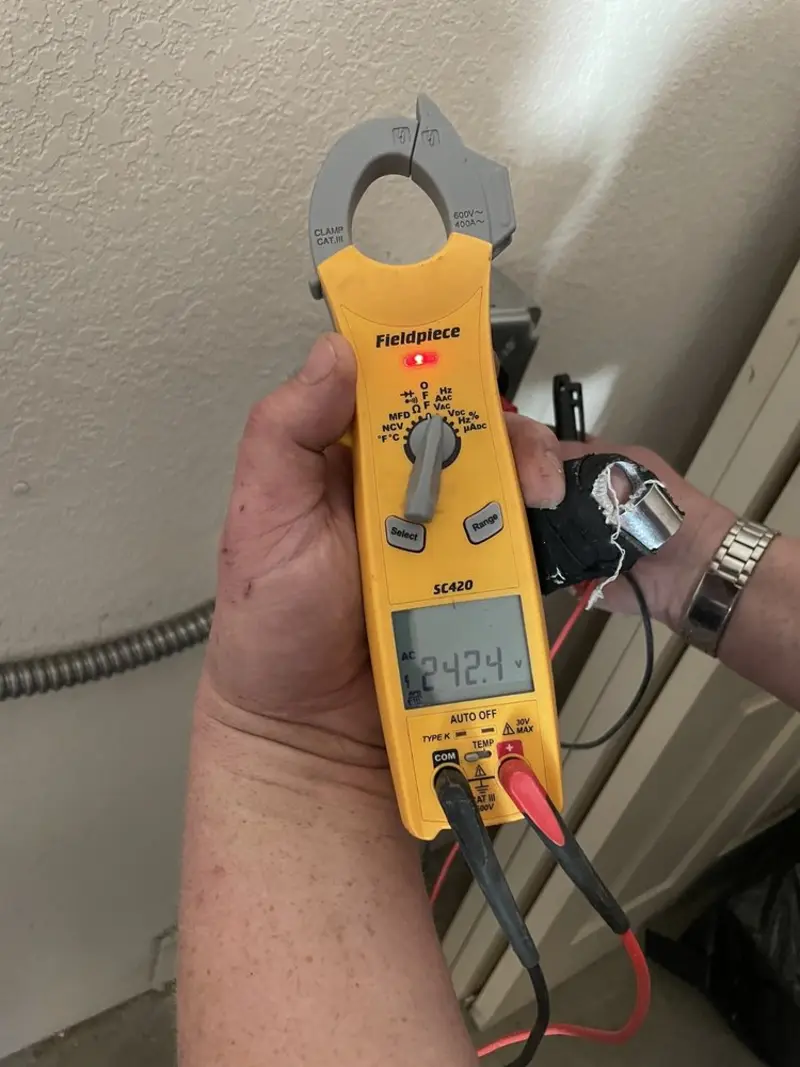 Voltage testing with clamp meter during Whole House Surge Protector in Cheney